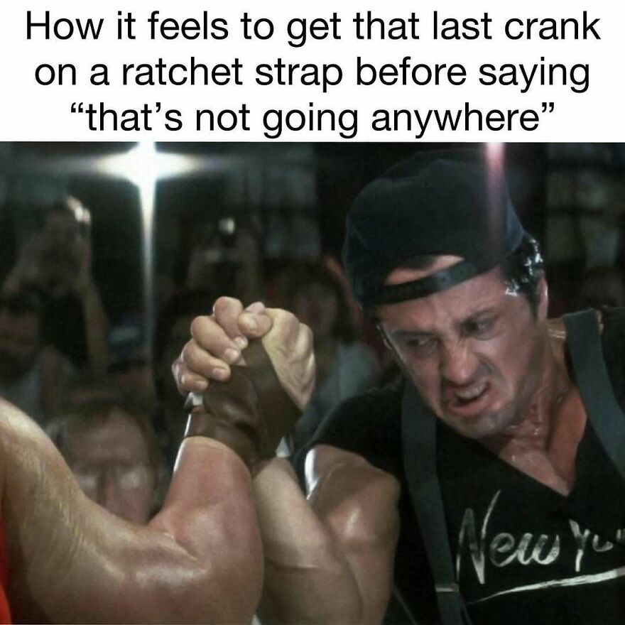 Two muscular men arm wrestling intensely with caption about ratchet strap struggle, illustrating dad memes and jokes humor.