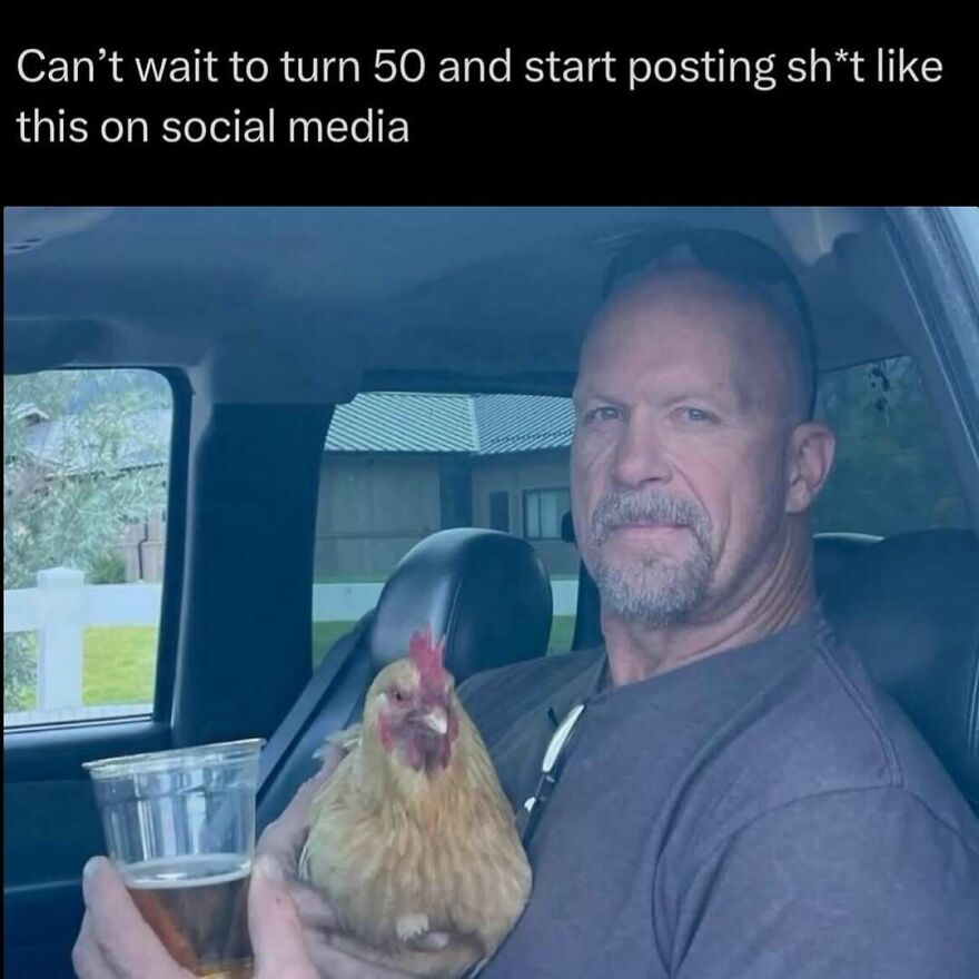 Man holding a chicken and a drink in a car, humorously capturing dad behavior in memes and jokes about dads.