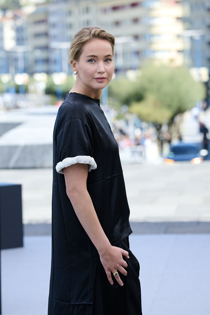 Jennifer Lawrence at Paris Fashion Week wearing black dress, sparking frenzy over plastic surgeon arrests in LA discussion. Jennifer Lawrence at Paris Fashion Week wearing black dress, sparking frenzy over plastic surgeon arrests in LA discussion.