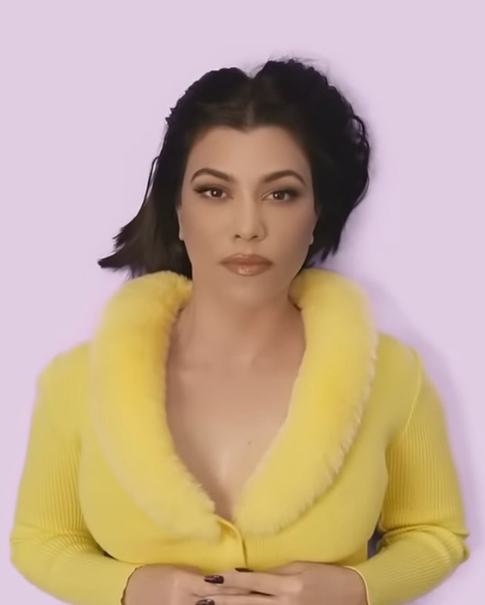 Kourtney Kardashian posing in a yellow outfit promoting lollipops for women’s private parts product launch. Kourtney Kardashian posing in a yellow outfit promoting lollipops for women’s private parts product launch.