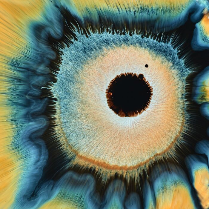 Abstract image of ink and water forming a hypnotic pattern that closely resembles a human eye.