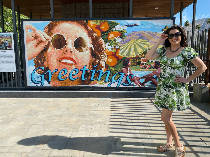 Woman posing by a colorful mural outdoors, part of a billboard campaign to find love attracting many responses. Woman posing by a colorful mural outdoors, part of a billboard campaign to find love attracting many responses.