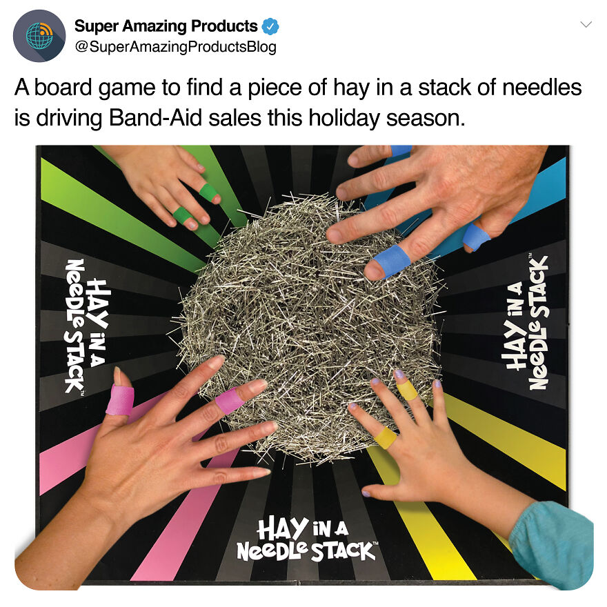 Hands with colorful bandaged fingers playing a prank board game featuring a pile of needles to confuse friends.
