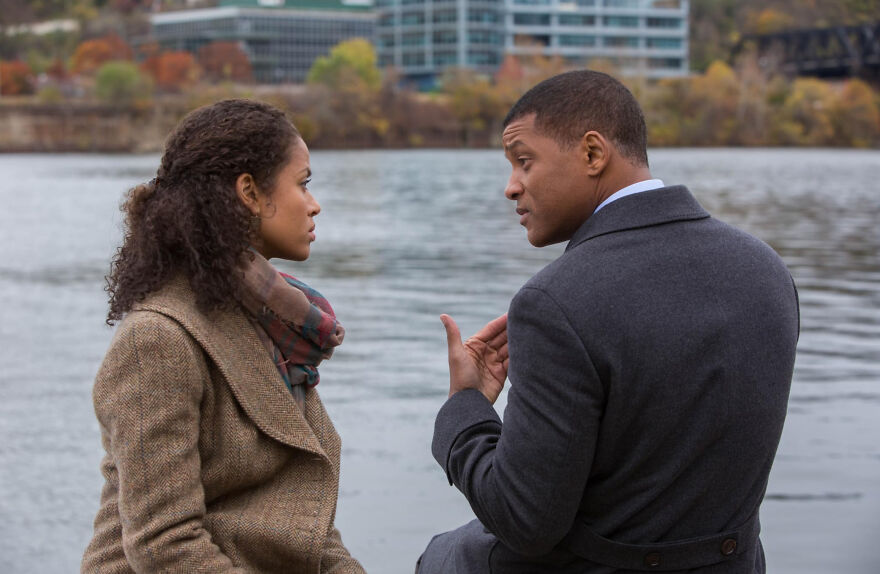 Two people having a serious conversation by a river, representing movies based on true stories that feel impossible to believe.