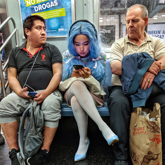 Diverse passengers including a woman with blue hair and headphones captured in NYC subway street portraits.