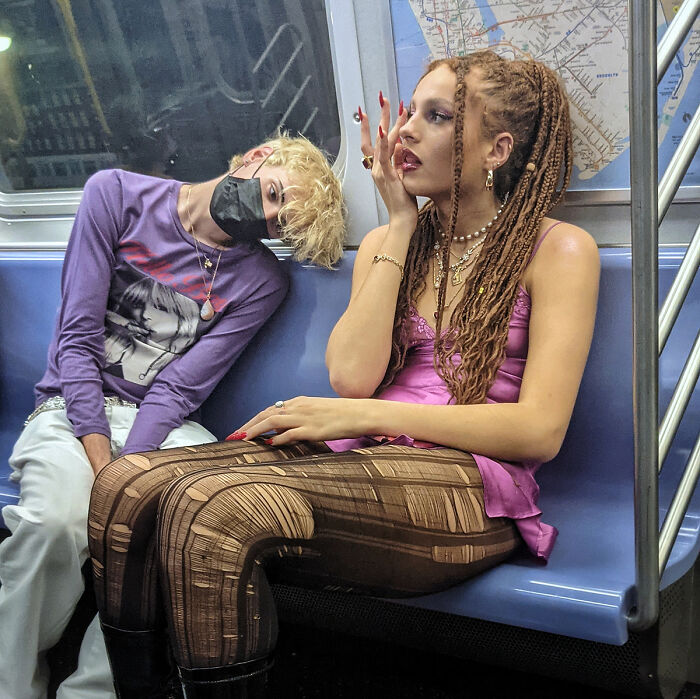 Two stylish young passengers captured in captivating street portraits riding NYC’s subway, showcasing urban life underground.