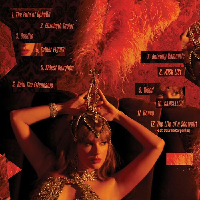 Taylor Swift in ornate outfit holding a jeweled hairbrush amid dark red background and feathered decor. Taylor Swift in ornate outfit holding a jeweled hairbrush amid dark red background and feathered decor.