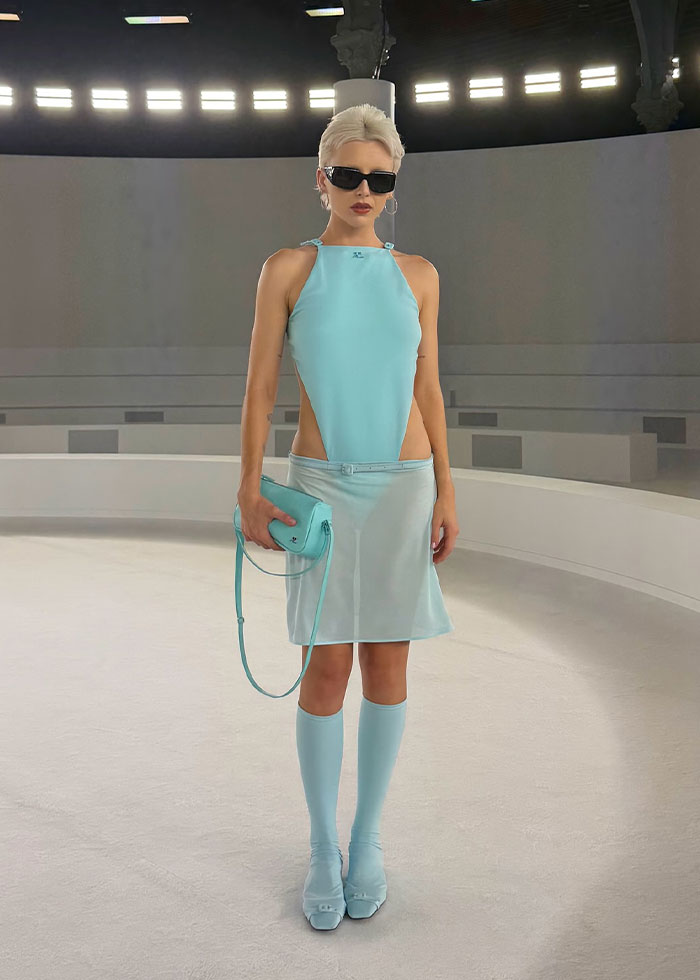 Celebrity wearing a light blue cut-out dress and matching accessories at Paris Fashion Week 2025 showcasing best and worst looks. Celebrity wearing a light blue cut-out dress and matching accessories at Paris Fashion Week 2025 showcasing best and worst looks.