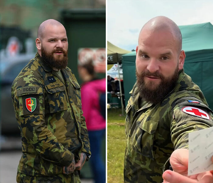 Bearded man in camouflage uniform showing honest reactions while viewing his own portrait captured by photographer.