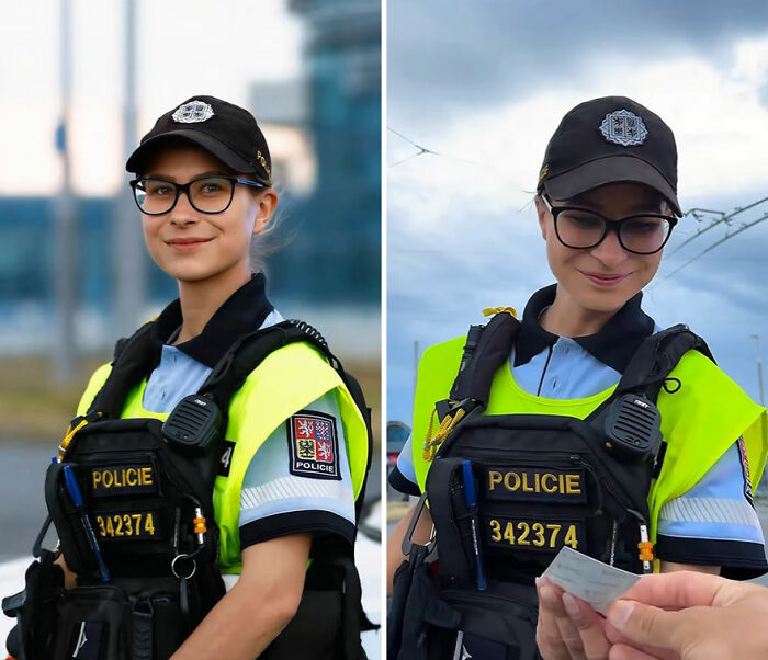 Female police officer smiling and reacting while looking at her own portrait captured by a photographer.