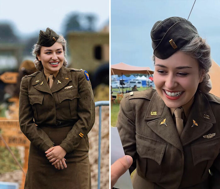 Young woman in vintage military uniform smiling as she reacts to her portrait captured by photographer recording honest reactions.