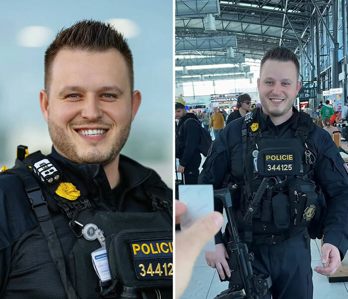 Smiling police officer in uniform reacting to his portrait captured by the photographer recording honest reactions.