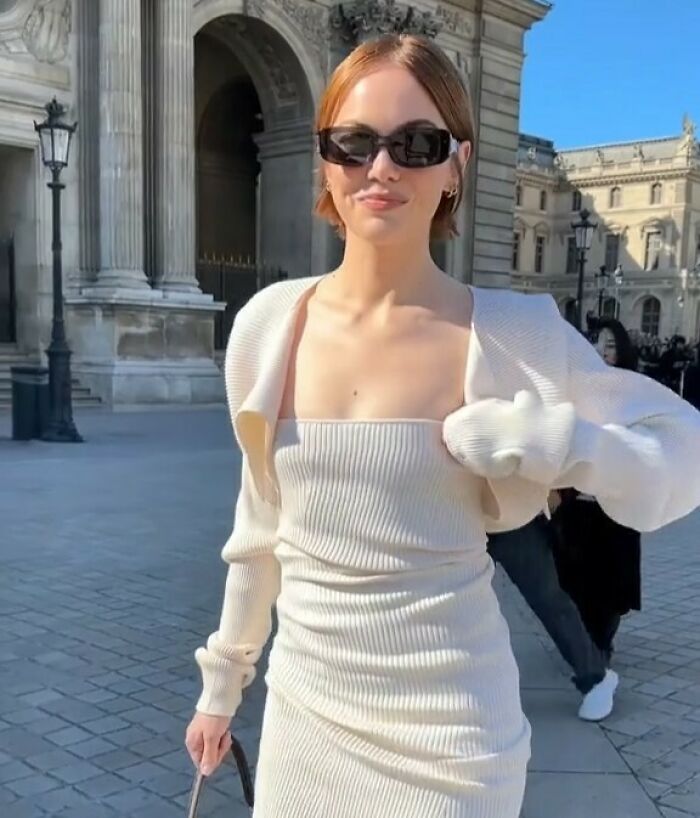 Emma Stone wearing white dress and sunglasses outdoors at Louis Vuitton event sparking plastic surgery speculation Emma Stone wearing white dress and sunglasses outdoors at Louis Vuitton event sparking plastic surgery speculation