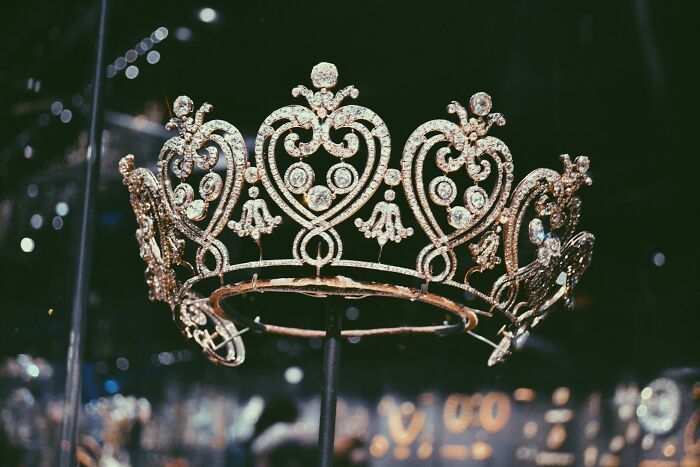 Intricate jeweled crown on display symbolizing popular kids and their shocking actions that led to becoming outcasts in school.