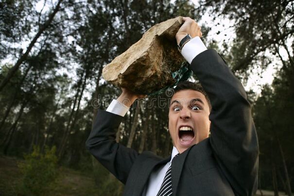 angry-businessman-outdoor-big-stone-hands-8998783.jpg