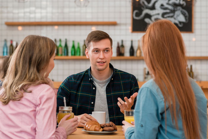 Three people having a tense dinner conversation, with wife confronting brother-in-law over racist slurs. Three people having a tense dinner conversation, with wife confronting brother-in-law over racist slurs.