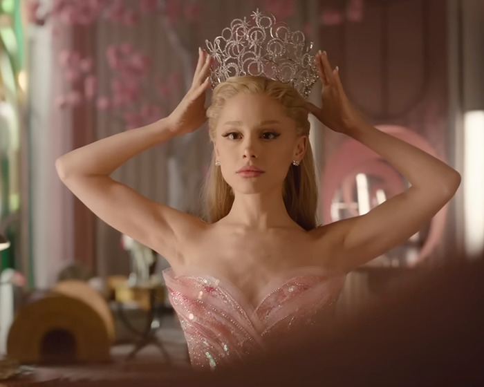 Ariana Grande with a dramatic new look wearing a crown and a pink gown, facing backlash from fans online. Ariana Grande with a dramatic new look wearing a crown and a pink gown, facing backlash from fans online.