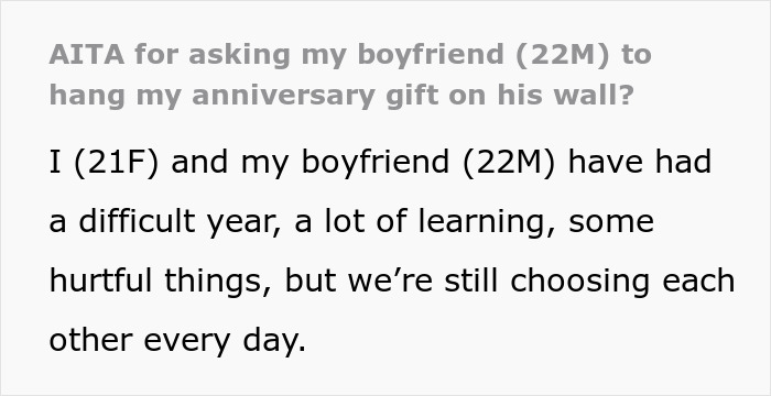 Text excerpt describing a difficult year and relationship challenges with boyfriend refusing to hang anniversary gift on wall.