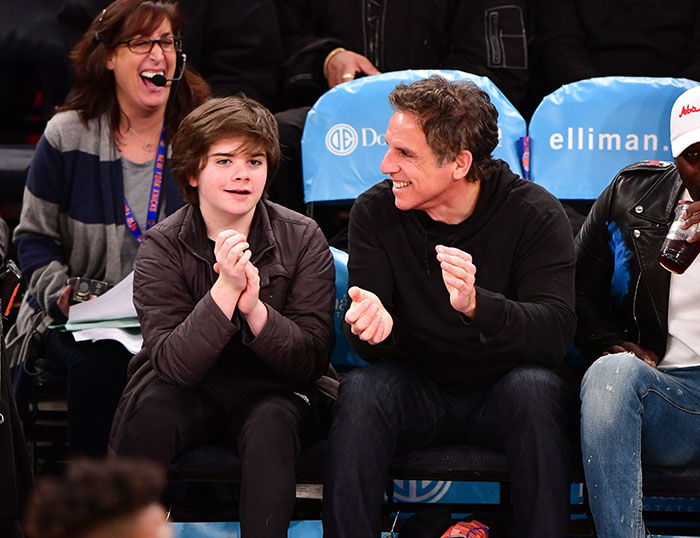 Ben Stiller smiling and clapping next to his son at a basketball game, reflecting on parenting mistakes and nepotism criticism. Ben Stiller smiling and clapping next to his son at a basketball game, reflecting on parenting mistakes and nepotism criticism.