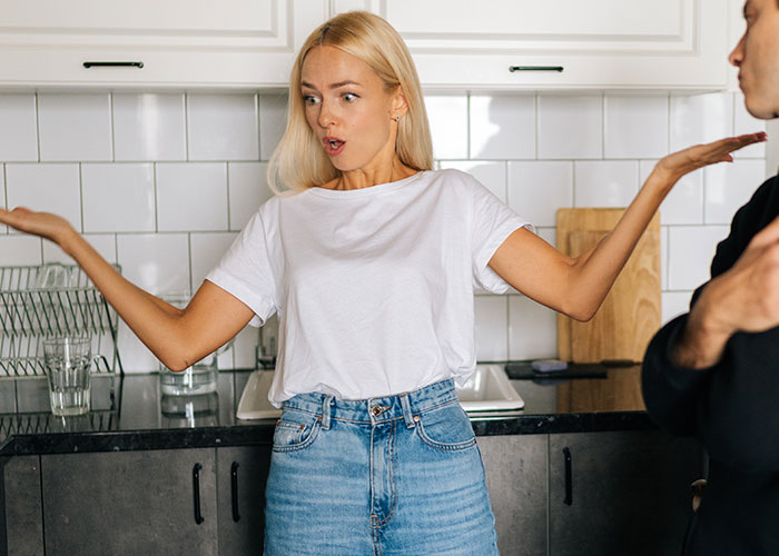 Woman calls out brother in kitchen, expressing frustration about having four kids with four different women. Woman calls out brother in kitchen, expressing frustration about having four kids with four different women.