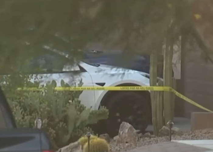 White car behind yellow police tape near desert plants at a crime scene linked to dad watched adult videos hot car case White car behind yellow police tape near desert plants at a crime scene linked to dad watched adult videos hot car case