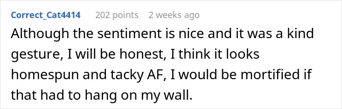 Comment expressing honest opinion about boyfriend refusing to hang anniversary gift on wall, calling it homespun and tacky.