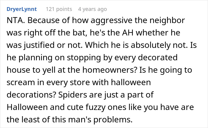 Screenshot of an online comment defending a couple’s Halloween decor against a threatening neighbor complaint.