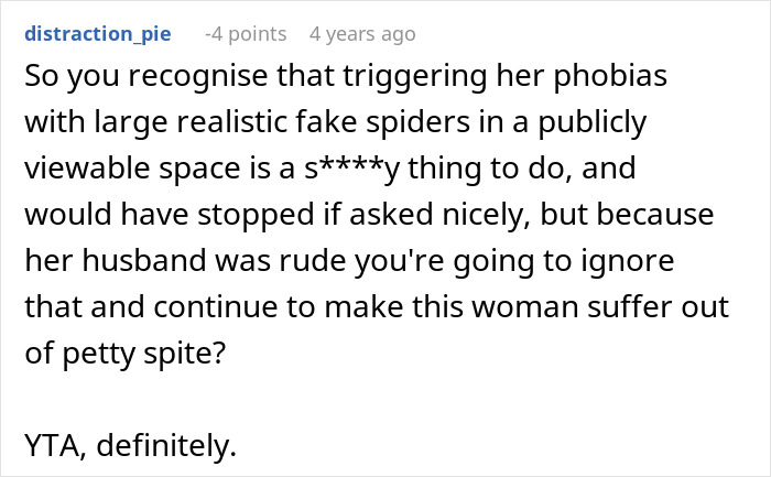 Comment discussing neighbor conflict over large realistic fake spiders in Halloween decor causing phobia triggers and petty spite.