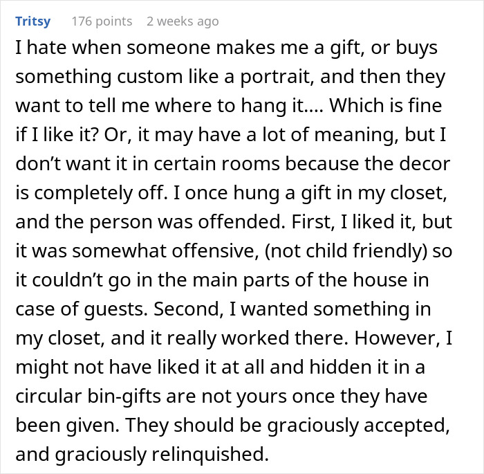 Comment explaining frustrations when a boyfriend refuses to hang an anniversary gift on the wall.