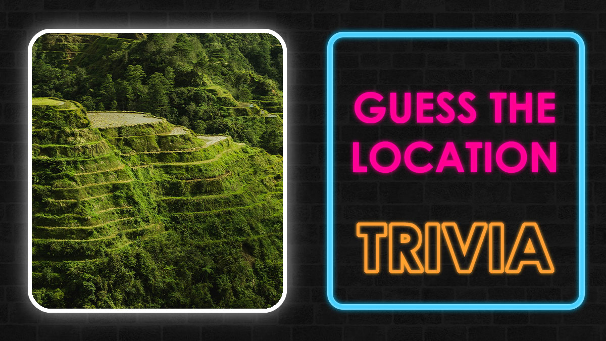 Terraced green hills with dense forest and neon sign reading guess the location trivia for country locations quiz.