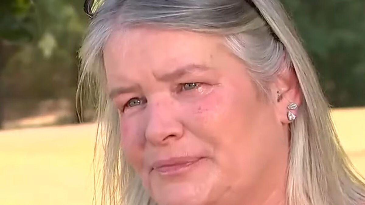 Middle-aged woman showing sisteru2019s emotional reaction with tears after missing brother found alive following years locked in basement