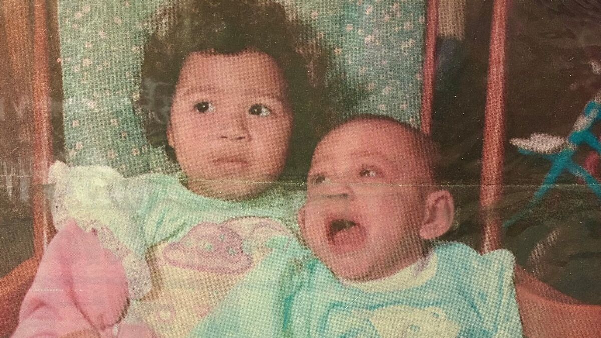 Vintage photo of two sisters as children, representing the miracle of sisters discovered alive after 36 years missing
