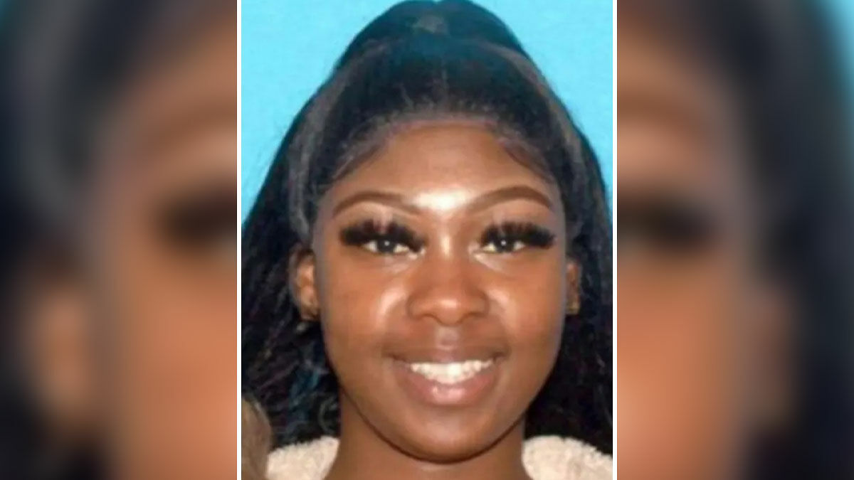 Young woman with long hair smiling in a close-up portrait, related to missing woman body discovery case.