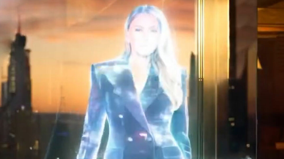 Melania Trump appearing as a glowing AI figure in a futuristic setting fueling conspiracy theory discussion.