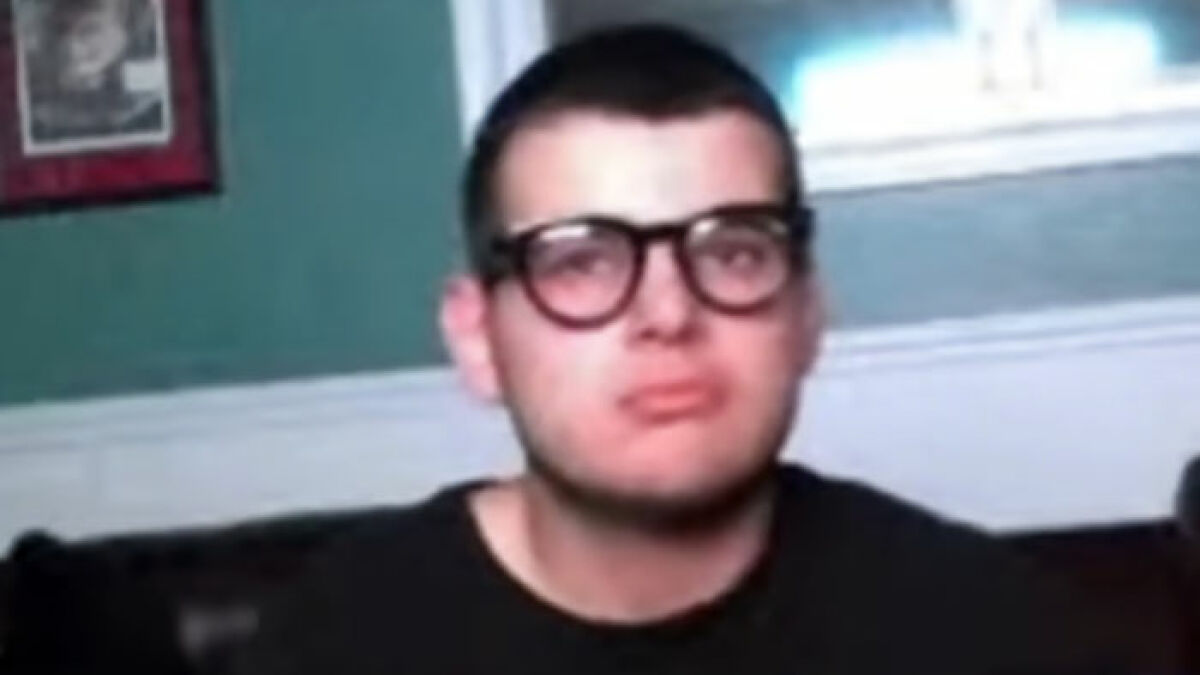 Teen driver wearing glasses and a black shirt, facing camera in an indoor setting, linked to fatal hit-and-run case.