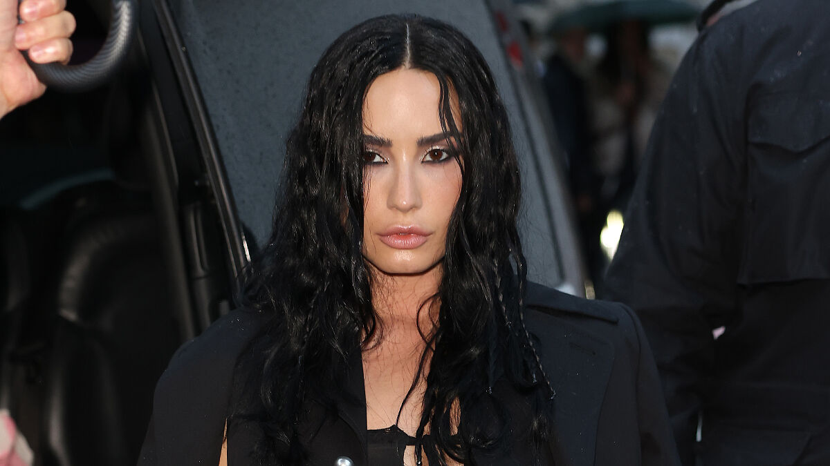 Demi Lovato with dramatic new look featuring sleek black hair and sharp facial features sparking buccal fat plastic surgery speculation