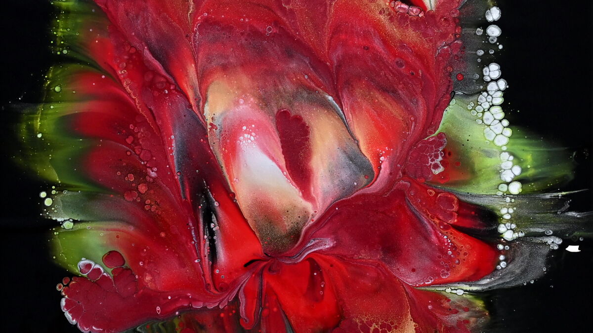 Abstract acrylic pour painting of vibrant red and green flowers with fluid textures and white bubble details on black background