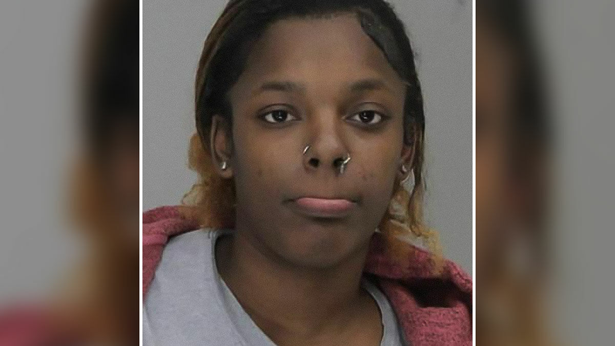 Woman with nose piercings in a close-up photo related to woman loses life outside pet store incident.