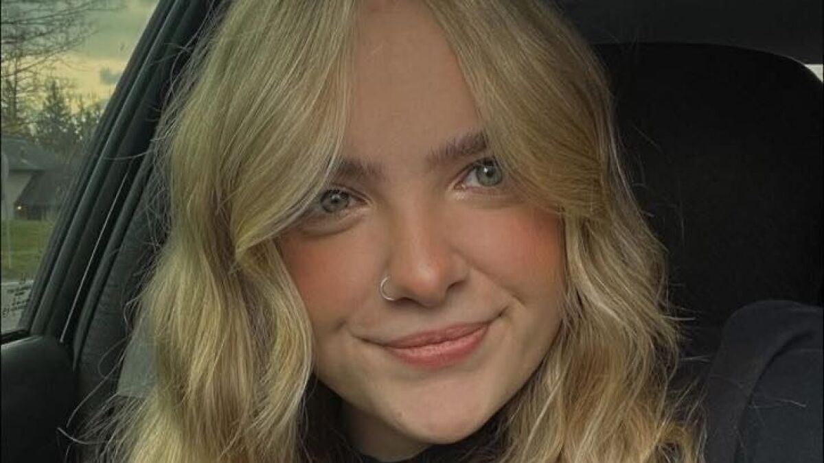 Young woman with blonde hair in a car, representing a music festival accident involving a woman attending to see Post Malone.