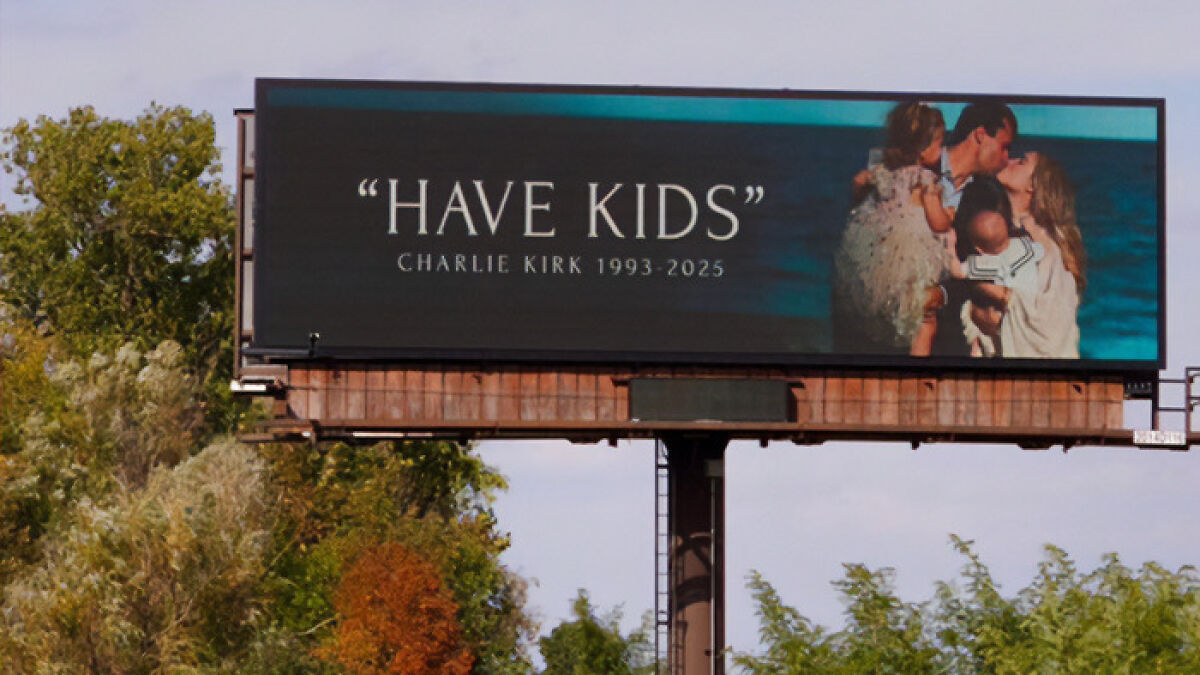 Billboard in Michigan with Charlie Kirk message on a very inventive form of birth control featuring a family image.