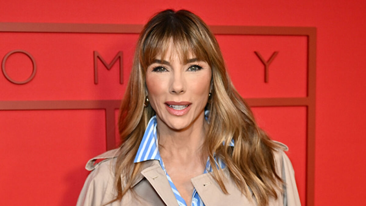 Sylvester Stalloneu2019s wife posing at a Hollywood event amid controversy over trans nepo babies remarks.