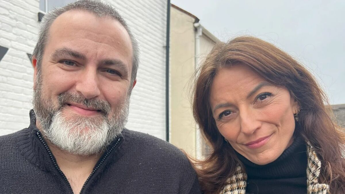 Man with beard and woman with brown hair smiling outdoors, relating to boy in momu2019s mysterious tattoo story.