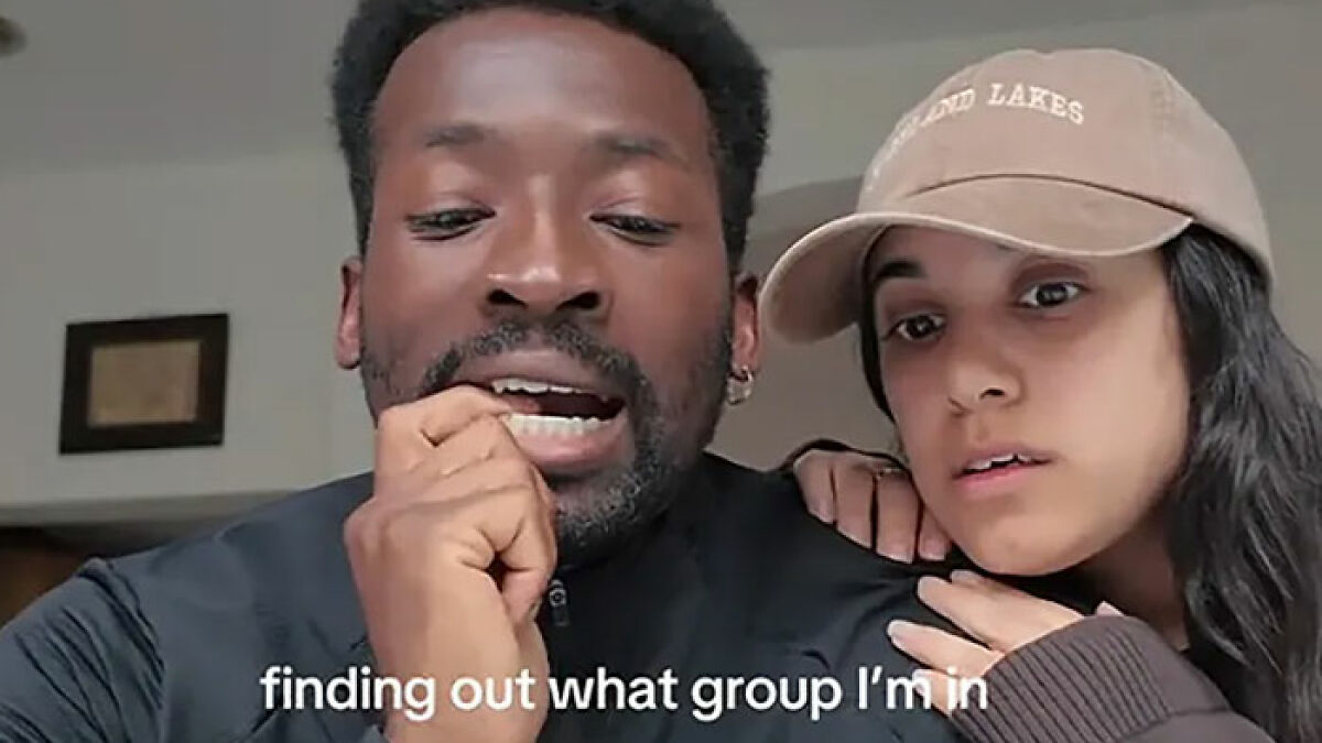 Two people reacting with curiosity, illustrating the viral Group 7 trend blowing up on TikTok.
