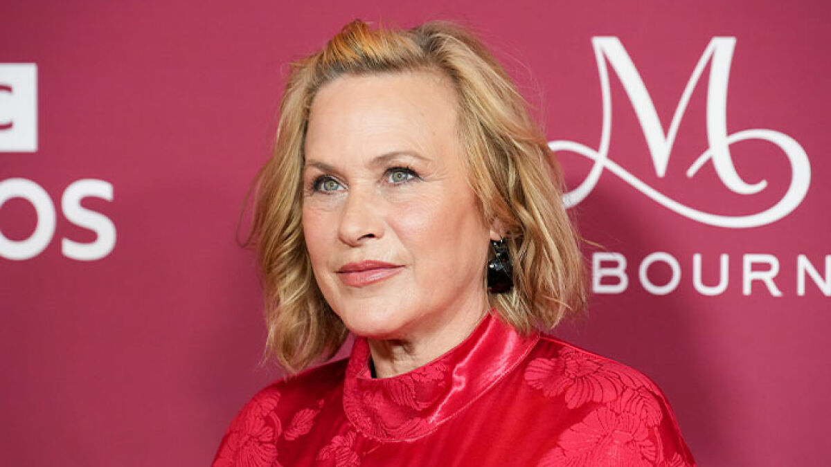 Actress in red dress at an event, highlighting celebrities revealing how brutally expensive being famous really is.