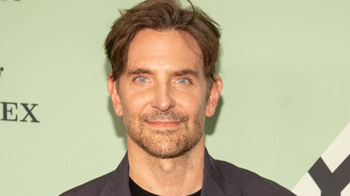 Bradley Cooper with a new radical makeover, sparking fan comparisons to Barry Manilow at a public event.