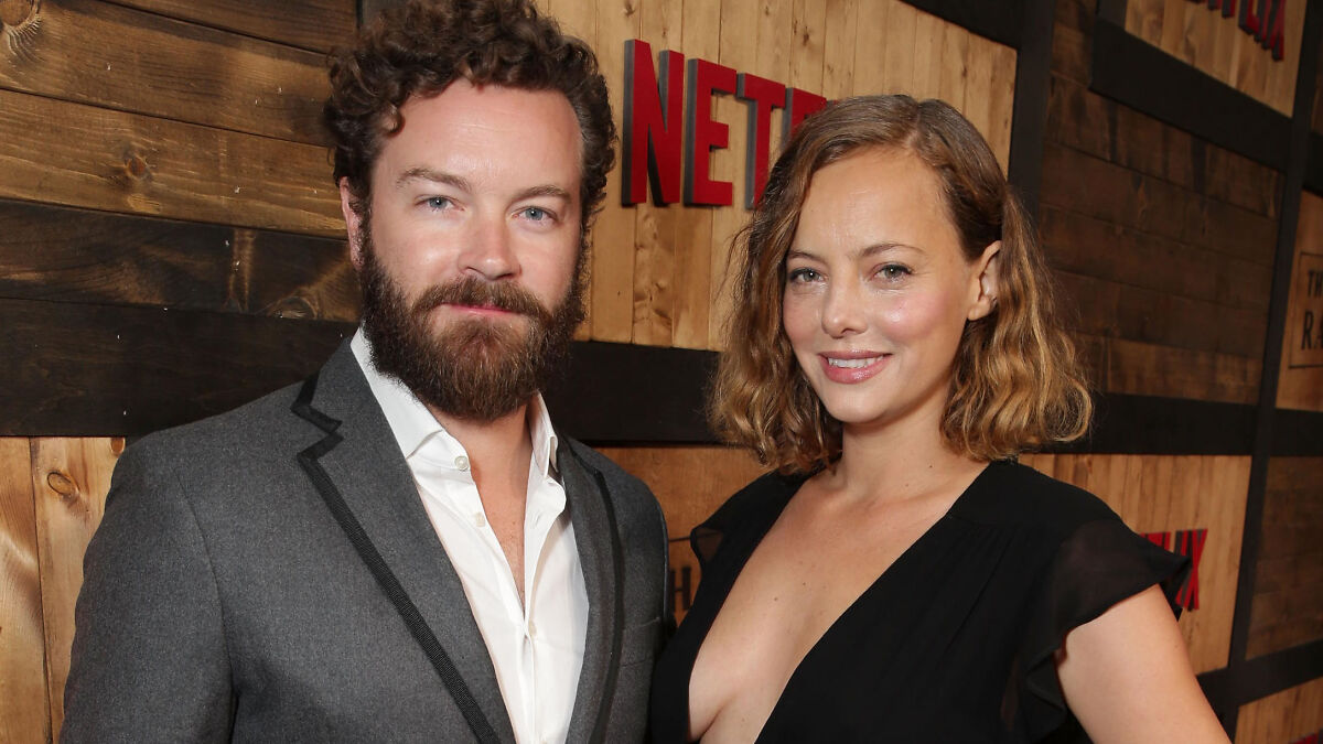 Bijou Phillips and Danny Masterson posing together at a Netflix event, highlighting Bijou Phillips cutting ties with jailed husband.