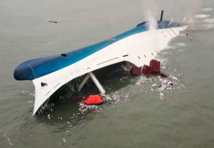 Capsized ship leaking debris in water, depicting a chilling and creepy found footage moment on video.