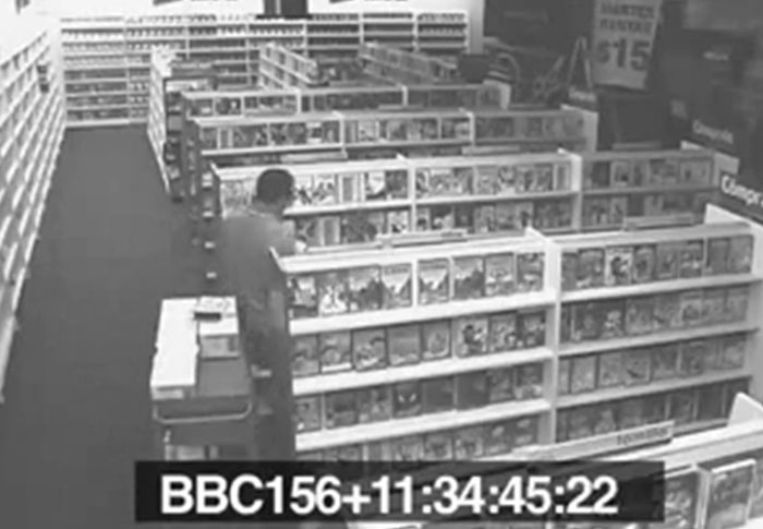 Black and white security footage of a person browsing in a store, one of the creepiest found footage videos captured.
