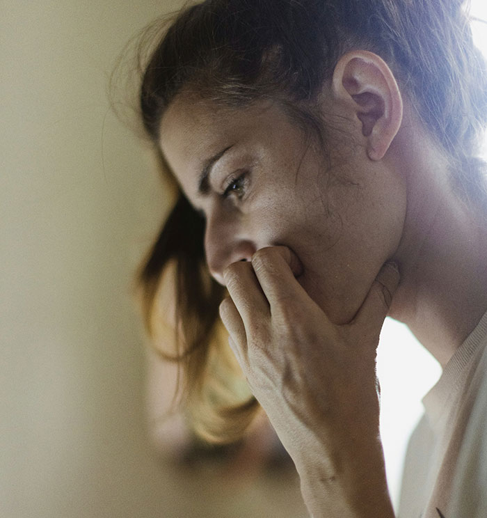 Young woman looking worried and thoughtful, reflecting on financial favor and loan repayment issues with millionaire boyfriend. Young woman looking worried and thoughtful, reflecting on financial favor and loan repayment issues with millionaire boyfriend.