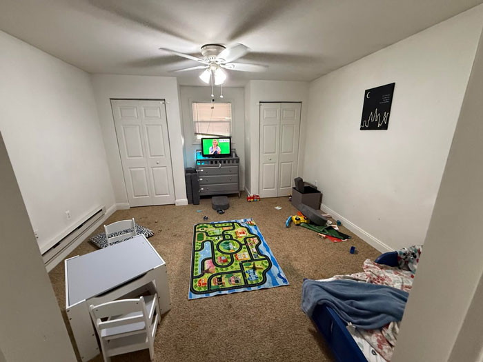 Playroom with scattered toys and kids' furniture, highlighting an exhausted mom's reality of a non-spotless house. Playroom with scattered toys and kids' furniture, highlighting an exhausted mom's reality of a non-spotless house.